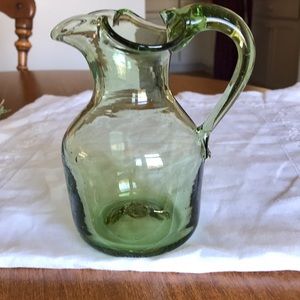 Translucent green glass pitcher.